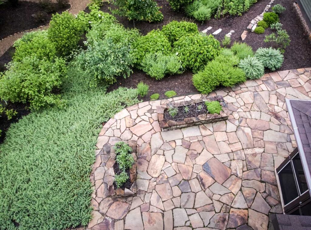 low-maintenance landscaping ideas | Stone patio and walkway hardscape