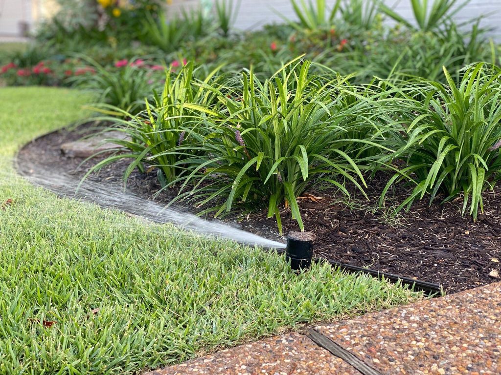 Residential landscape bed irrigation and edging considered when choosing mulch rock or gravel for landscape beds in North Port