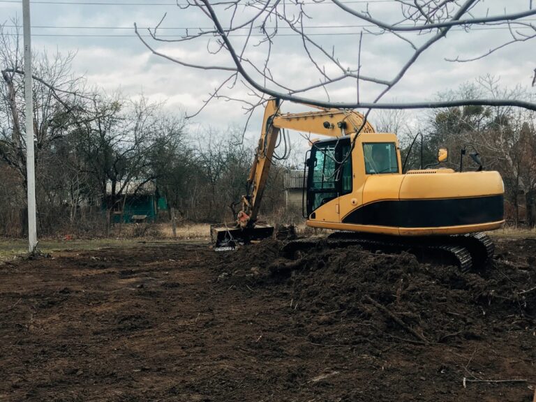 Lot clearing vs house pad grading North Port residential construction site showing cleared land and prepared soil