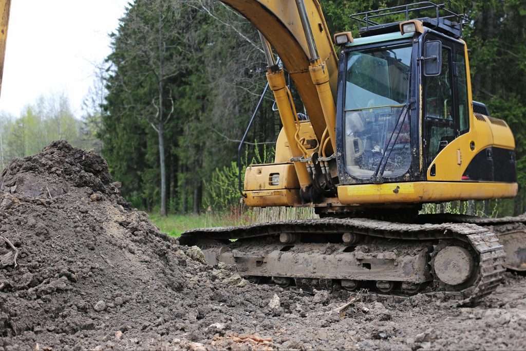 Residential lot clearing in North Port with vegetation removal before construction